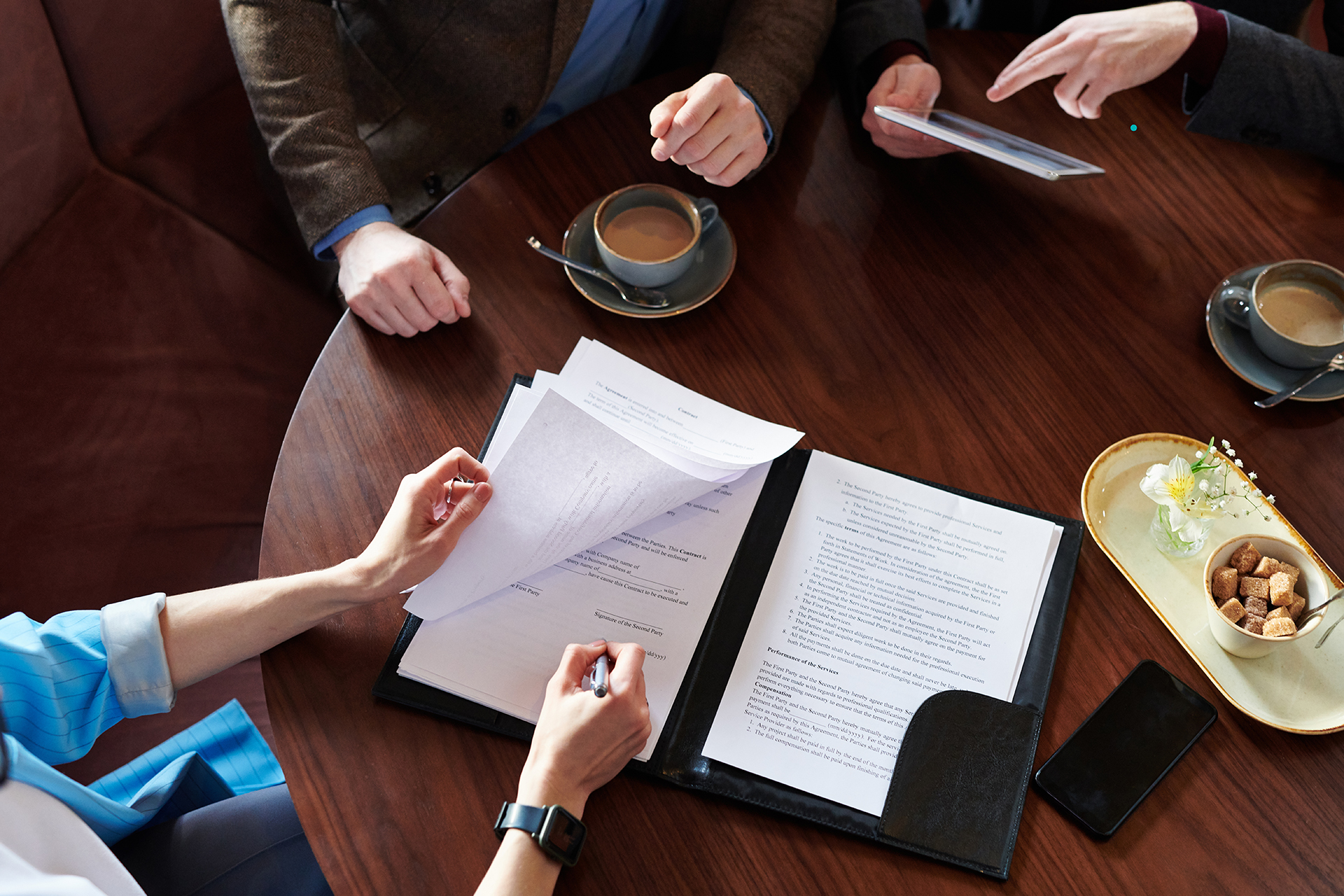 Signing contract in cafe signing business contracts